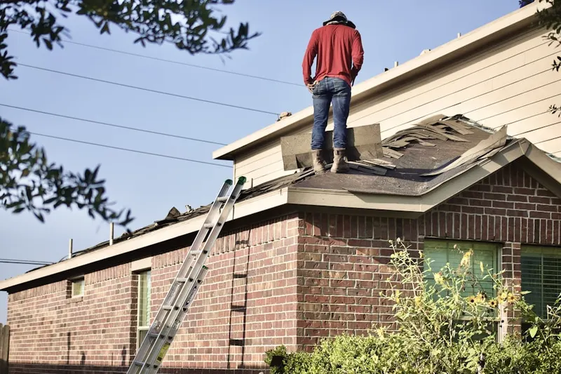 Professional roofer working on a residential roof in Northpointe